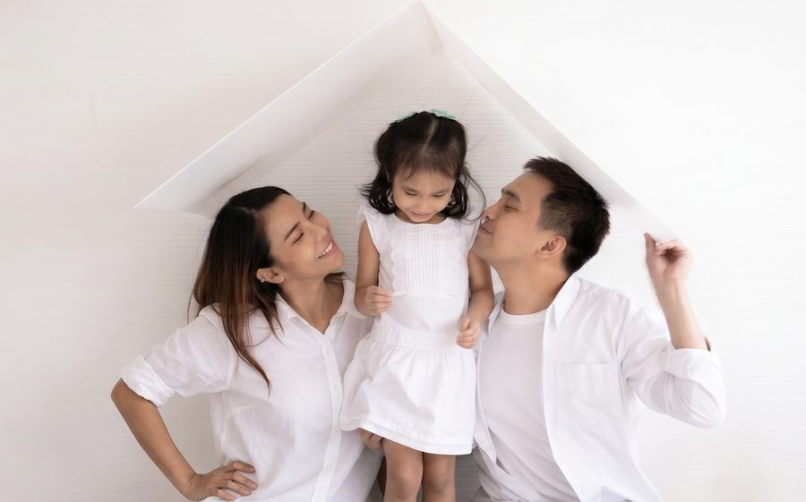 Filipino family under the roof of their home